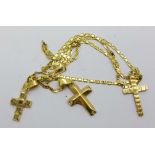 An 18ct gold chain with three gold cross pendants, total weight 4.