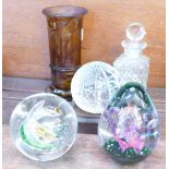 Three glass paperweights including a Waterford globe of the world,