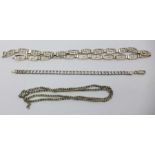 Two silver neck chains, one lacking fastener, and a silver bracelet,
