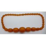 A string of amber coloured beads