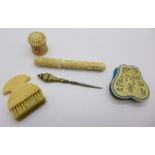 Needlework items including an ivory brush and a carved pin cushion
