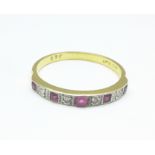 An 18ct gold, ruby and diamond nine stone ring, 2.