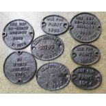 Eight small cast iron rail plaques