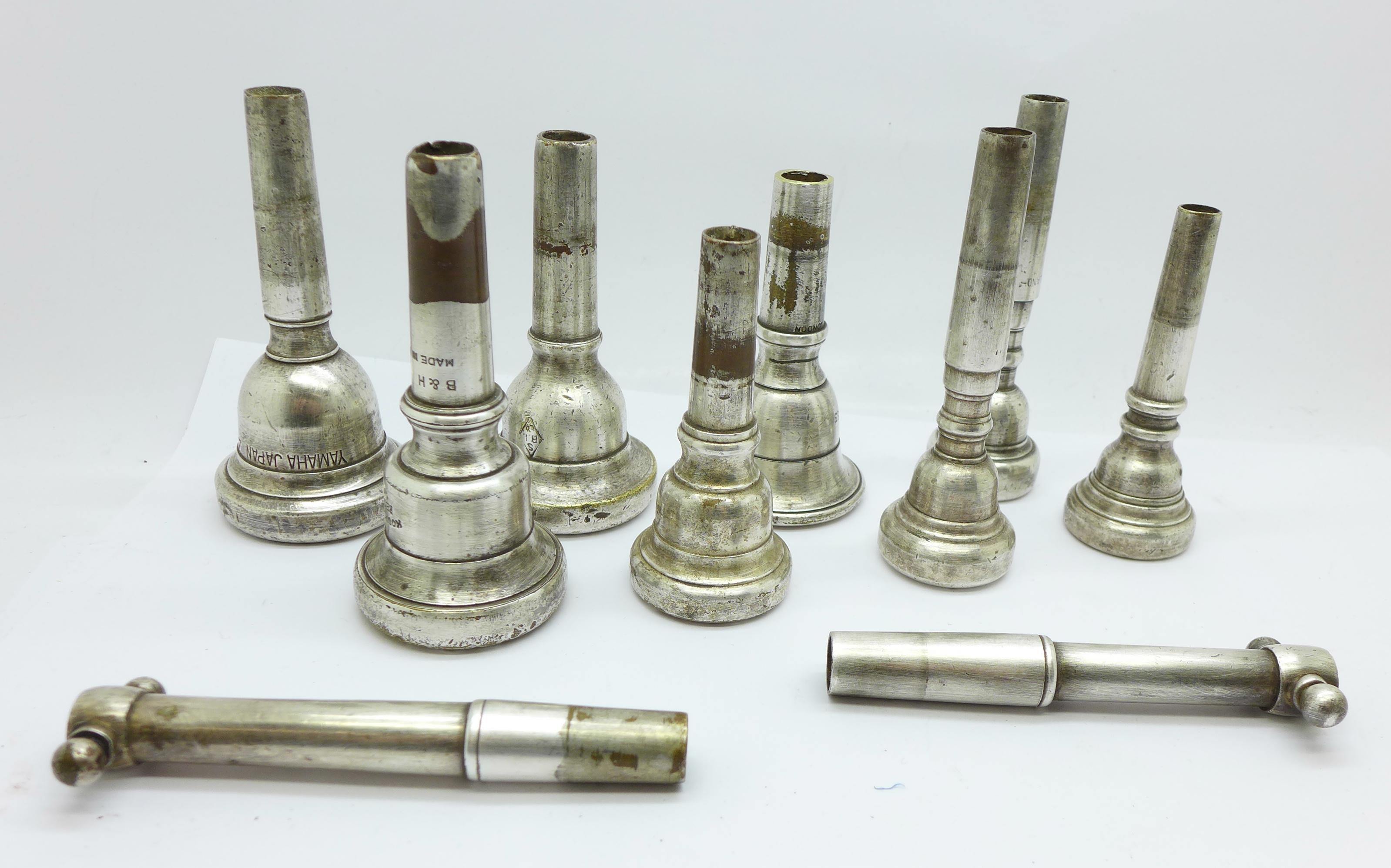 Eight wind instrument mouthpieces, including Kosicup,