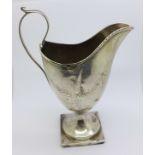 A white metal cream jug, with makers mark,
