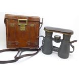 A pair of German WWI period binoculars with integral compass, cased, the case marked Emil Busch A.G.