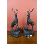 A pair of small French style bronze stags,