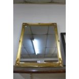 A gilt framed mirror