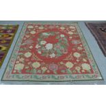 A Bessarabian flat weave red ground floral rug, 200cm x 222cm
