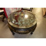 A Chinese black chinoiserie circular coffee table