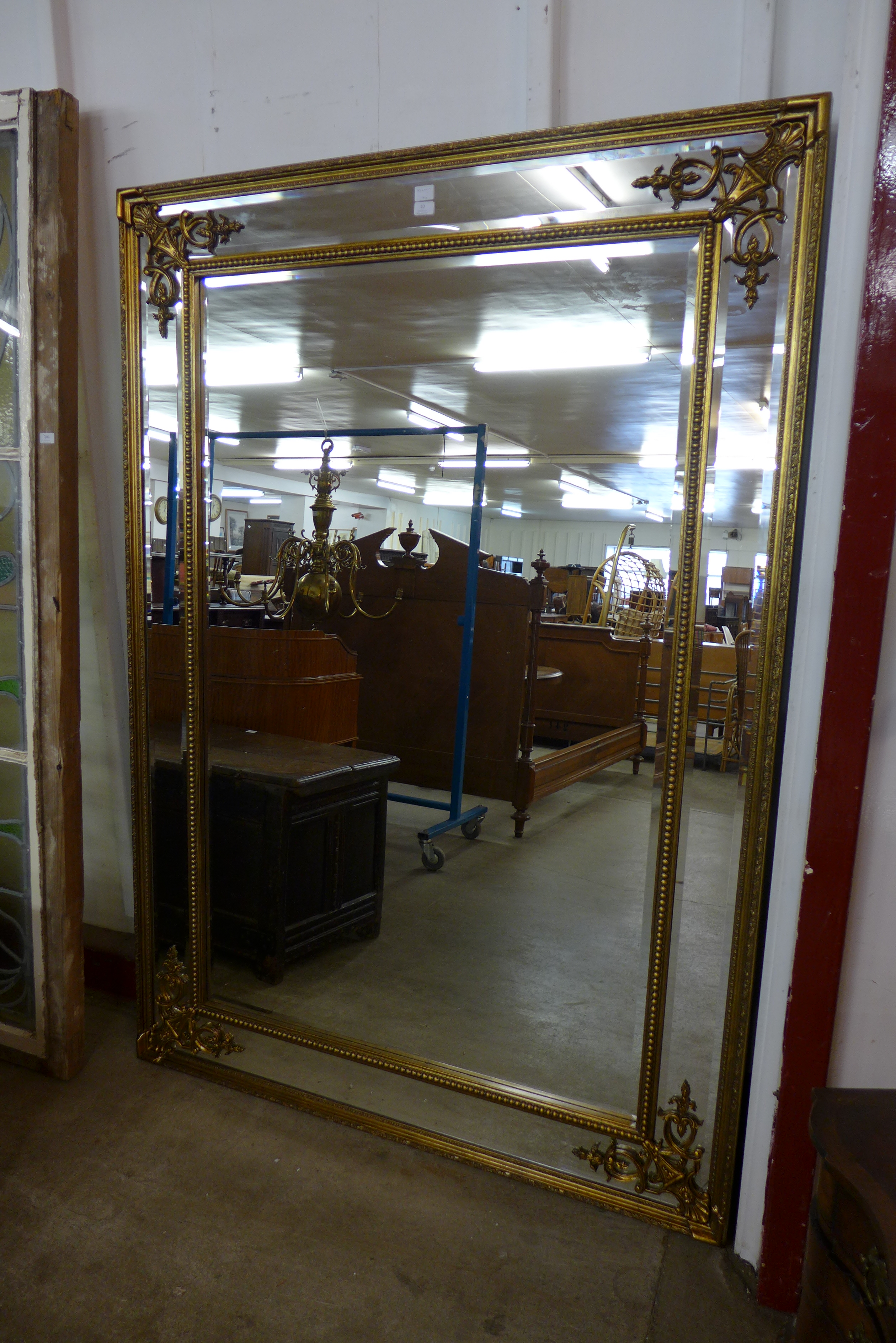 A large French style gilt framed mirror,