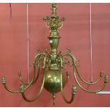 A large Dutch brass eight branch chandelier