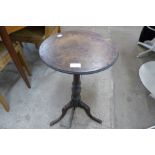 A George III oak circular tripod table