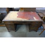 A mahogany pedestal desk