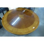 An inlaid mahogany circular coffee table