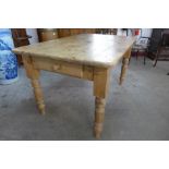 A pine single drawer farmhouse kitchen table