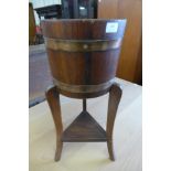 A coopered oak jardiniere on stand