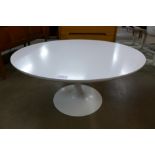 An Arkana tulip shaped coffee table,