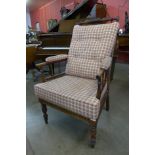 A Victorian elm and upholstered armchair