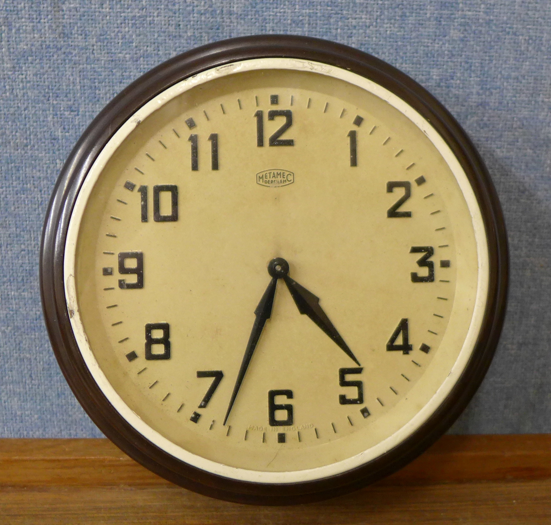 A Bakelite circular wall clock