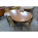 A G-Plan Fresco teak extending dining table and four chairs