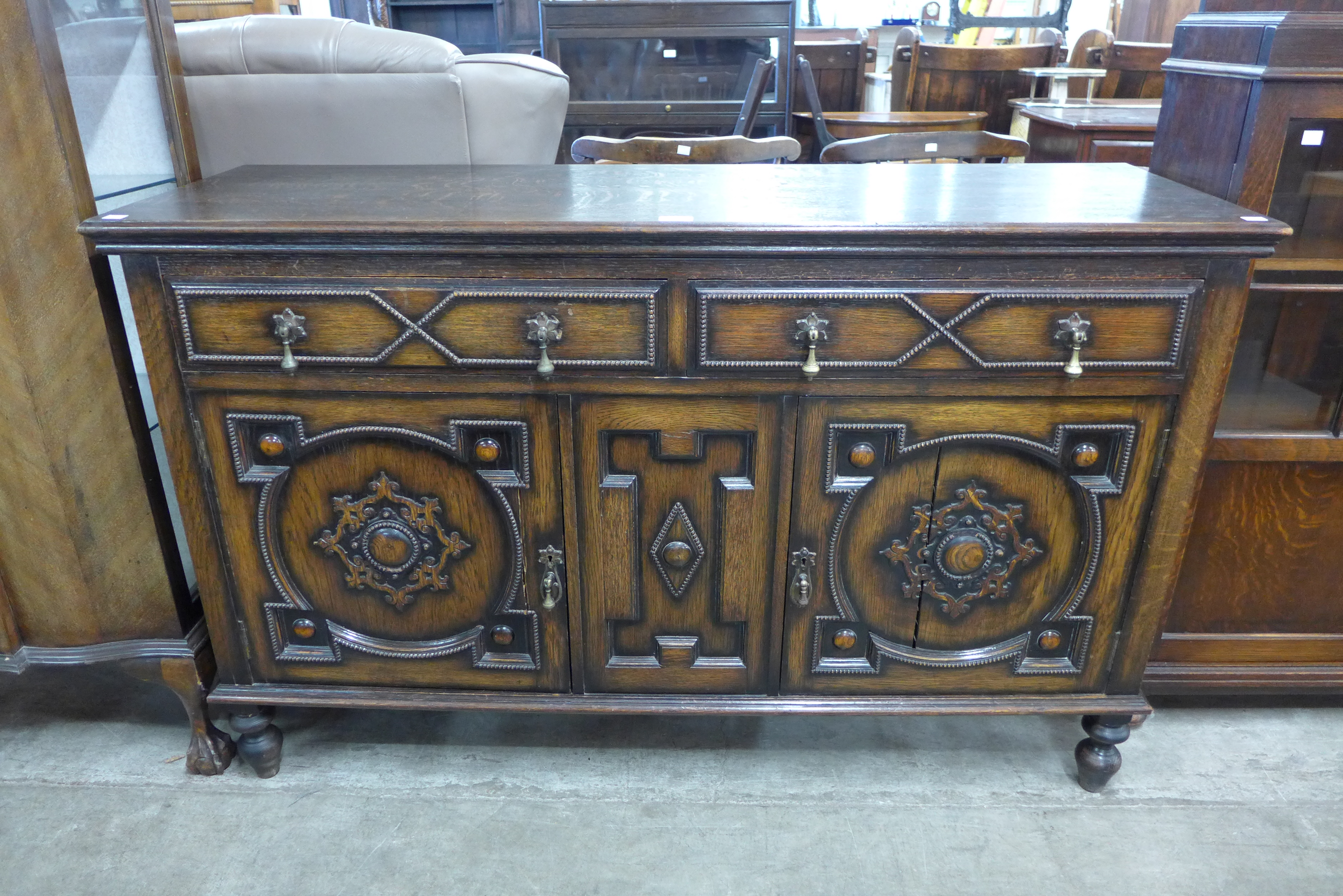 A carved oak sideboard