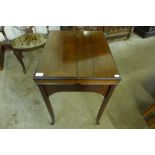 An Edward VII mahogany surprise fold-over lady's writing table