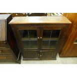 A carved oak bookcase