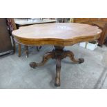 A Victorian walnut serpentine tilt-top breakfast table