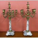 A pair of gilt metal and marble candelabra