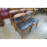 A set of four Danish teak dining chairs