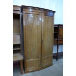 A Victorian mahogany bow front wardrobe