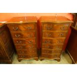 A pair of mahogany serpentine chests of drawers