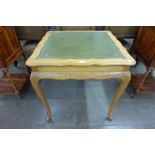 An early 20th Century satin birch games table
