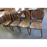 A pair of Ercol chairs and two more similar