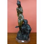 A French style bronze figure of an Arabic man with nude female,