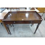 A Victorian mahogany single drawer writing table