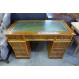 A yew wood pedestal desk