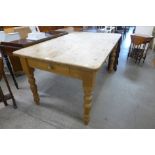 A pine single drawer farmhouse kitchen table