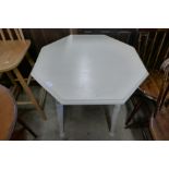 An Arts and Crafts painted octagonal table