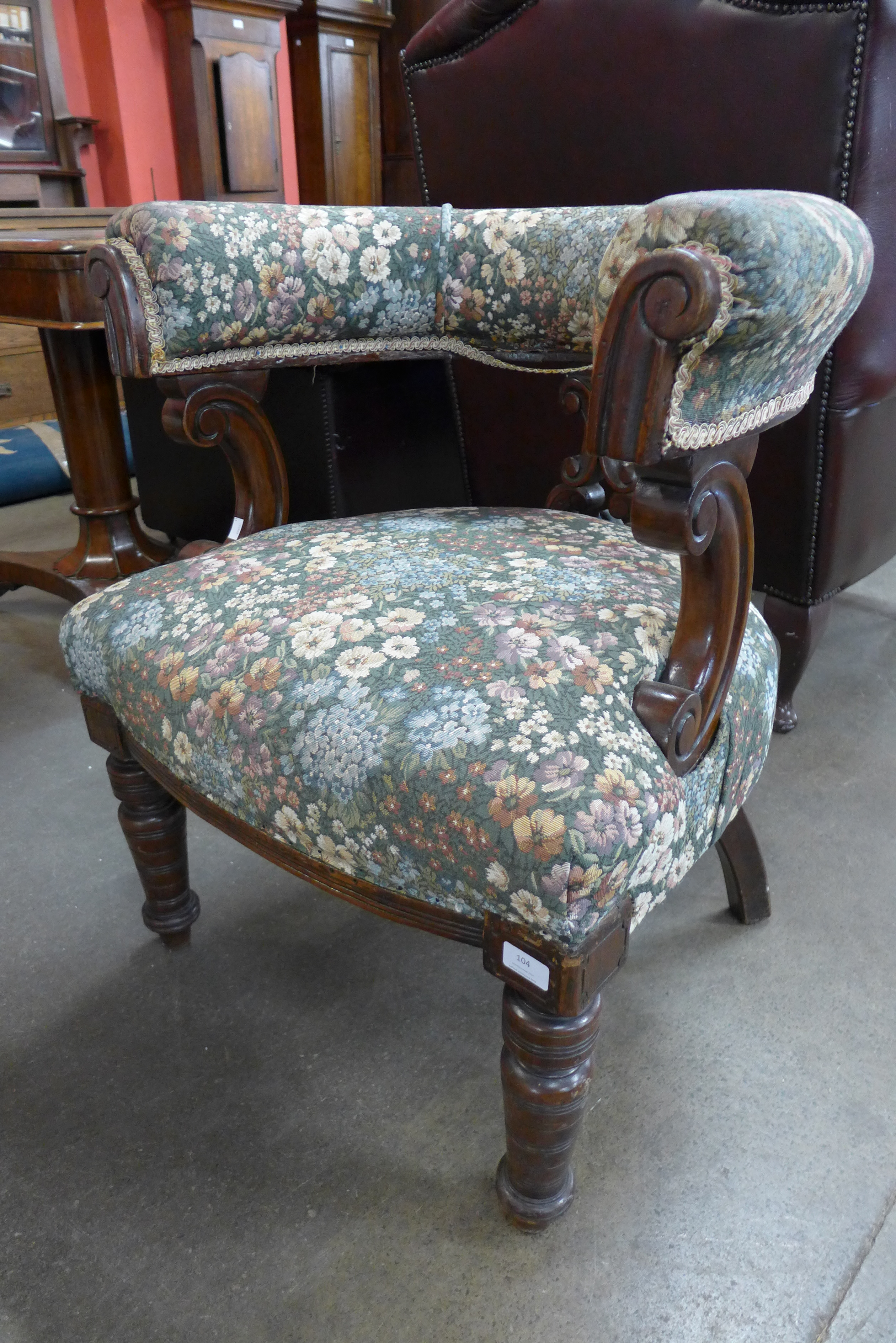 A Victorian oak and upholstered library chair