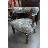 A Victorian oak and upholstered library chair
