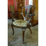 An Edward VII inlaid mahogany elbow chair