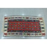 A Turkish Konya red ground Kilim, 99cm x 198cm