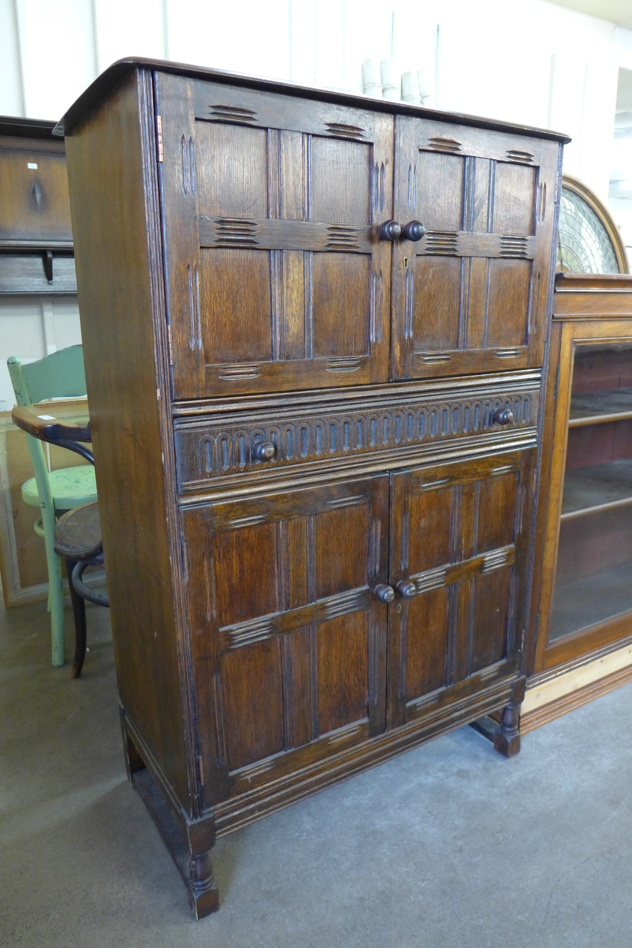 An oak cocktail cabinet