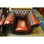 An oxblood leather tub chair