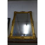 A gilt framed mirror