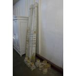 A set of four painted wooden columns