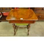 A Victorian walnut sewing table