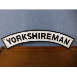 A reproduction cast iron Yorkshireman railway sign